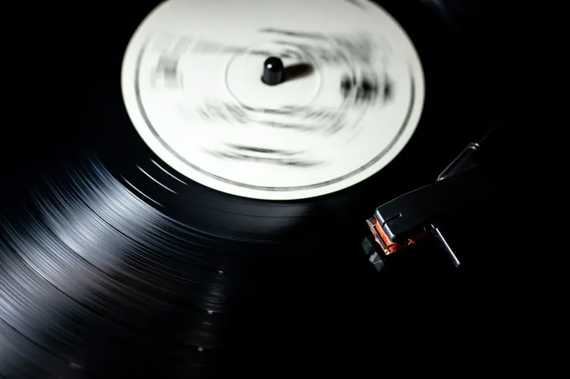 Close-up of a vintage vinyl record spinning on a turntable