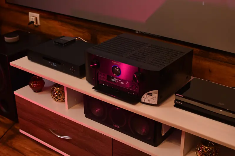 A sophisticated home theater setup featuring a modern amplifier surrounded by speakers, ideal for electrifying music experiences