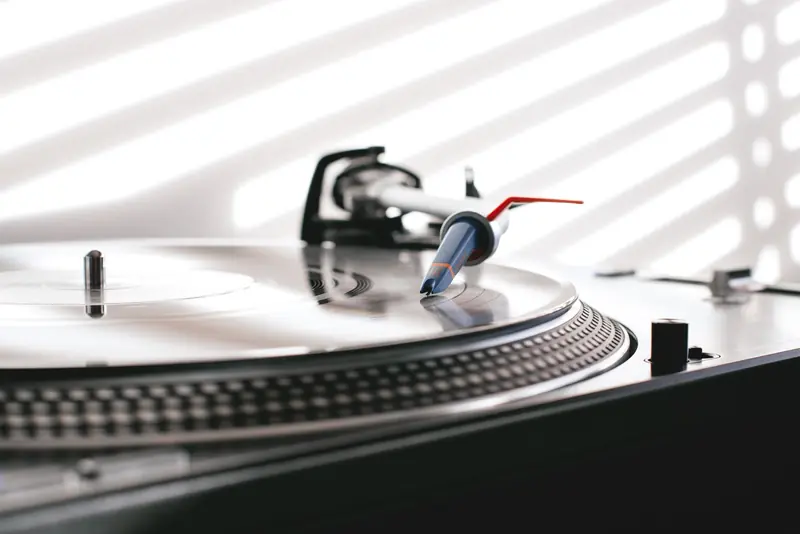 Stylish close-up of a vinyl record spinning on a turntable with needle