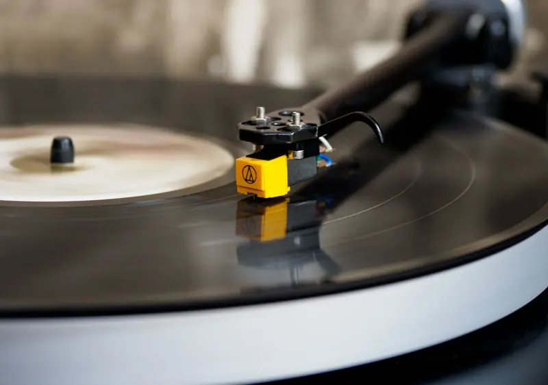 High-resolution image of a spinning vinyl record on a turntable, capturing the classic audio experience